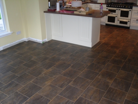 Imperfect Subfloor transformed by a  Perfect Karndean Floor